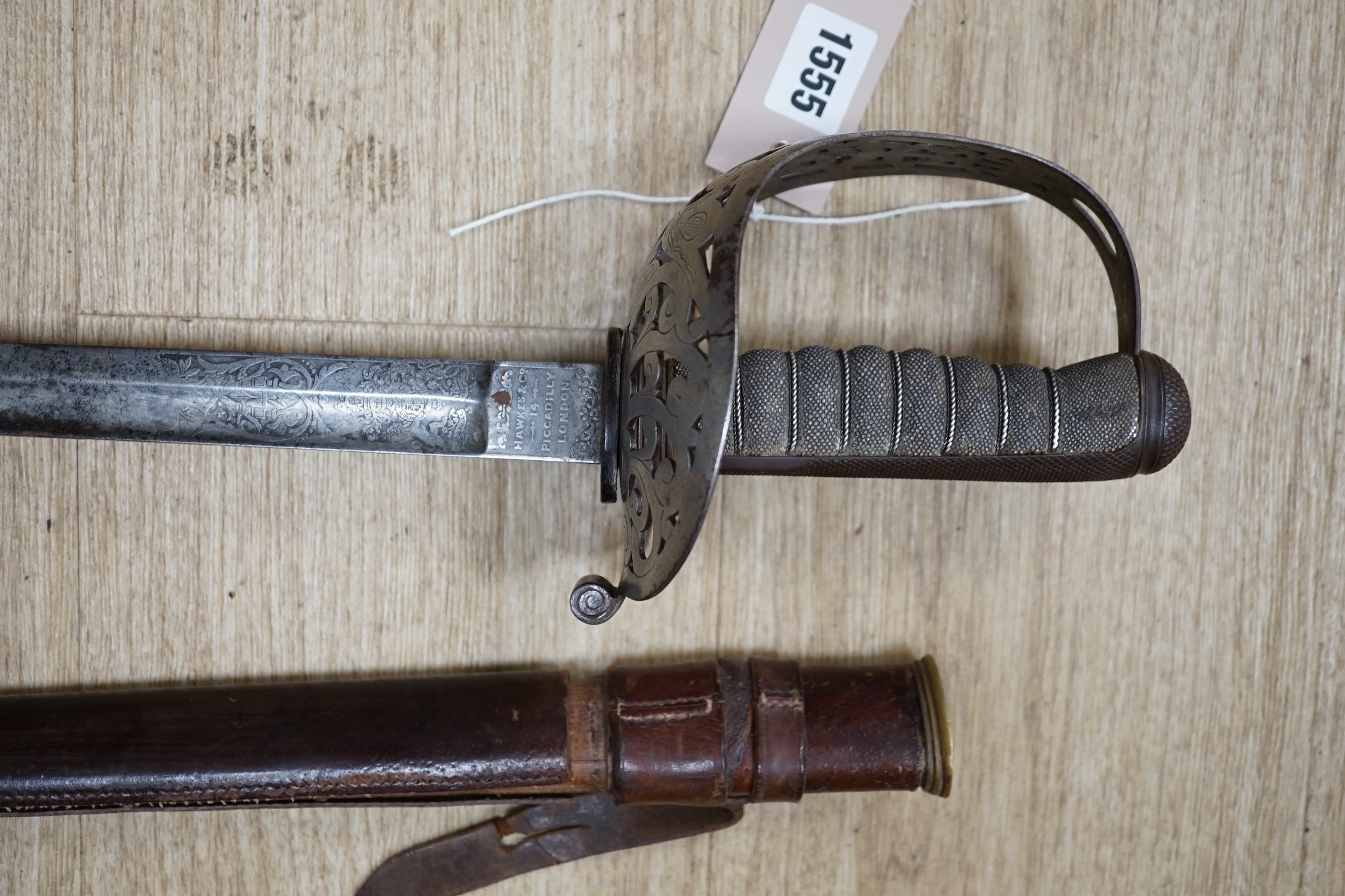 A George V dress sword, in a leather scabbard, 108cm long